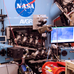 Eight 2 inch clear telescopes arranged around NASA Ames hypervelocity gun target chamber